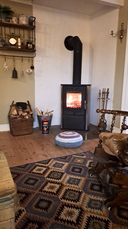 Cozy wood stove burning indoors