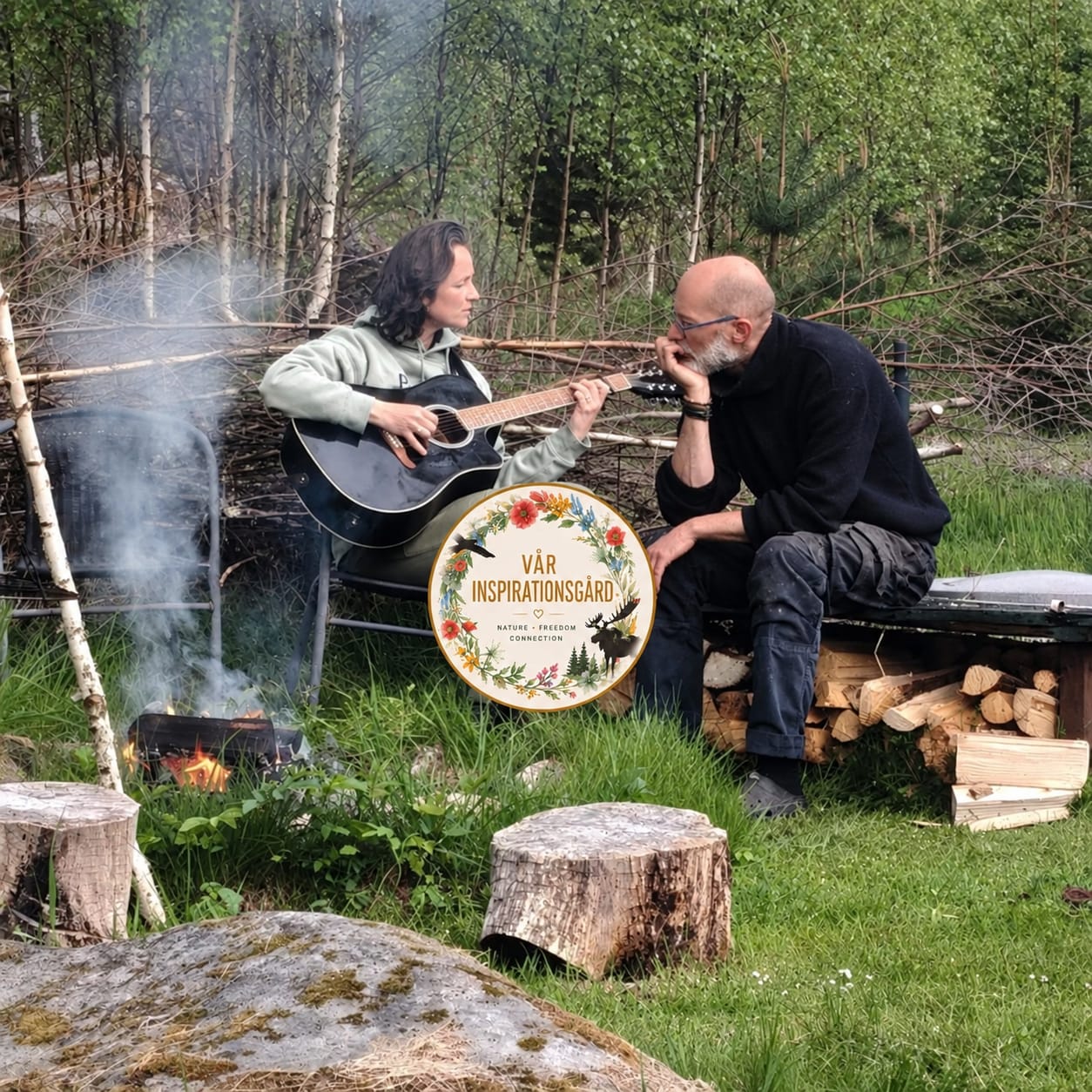 Playing music by the campfire — guitar and flute in the forest