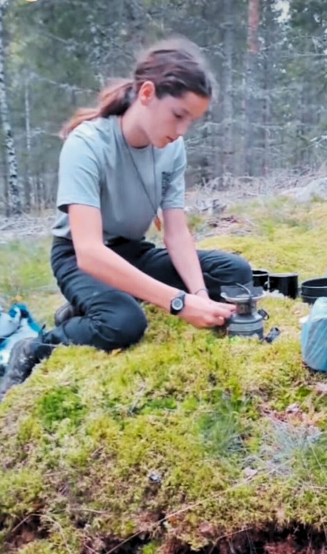 Cooking on a camp stove in the forest