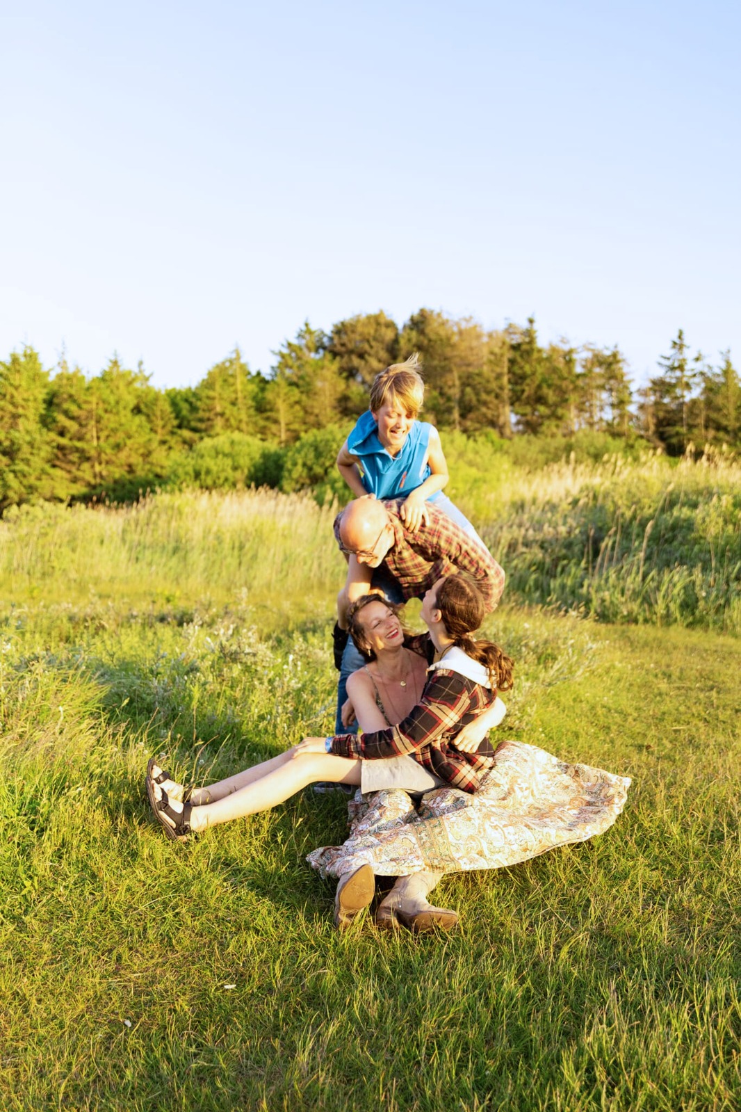 Our family together in the meadow at golden hour